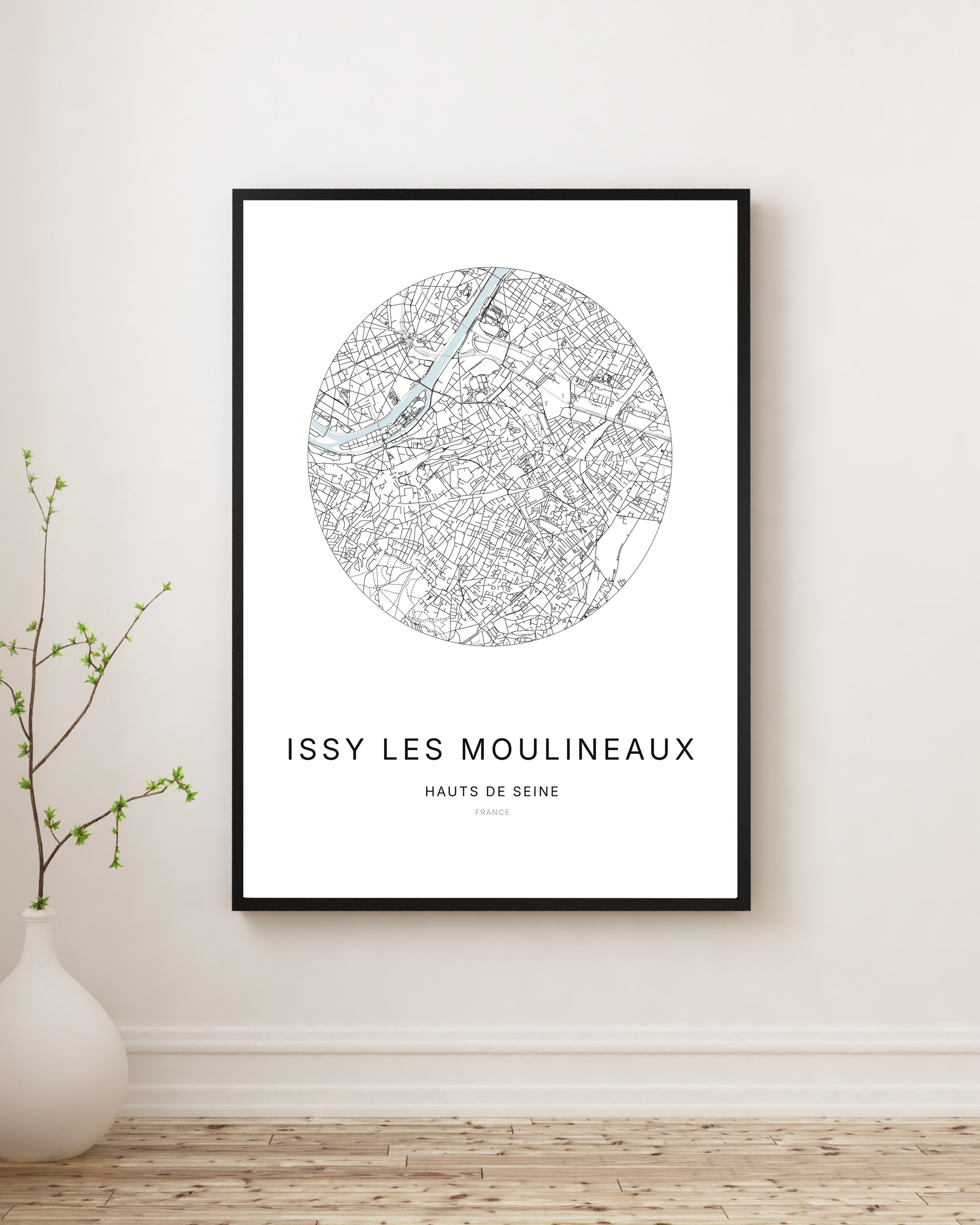 Affiche plan de ville minimaliste de Issy-les-Moulineaux encadrée en noir.