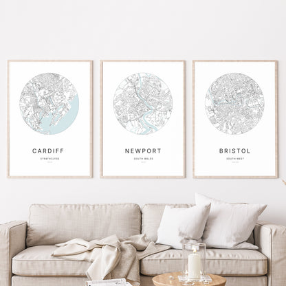 Trio of Cardiff, Newport and Bristol city map prints in a living room.