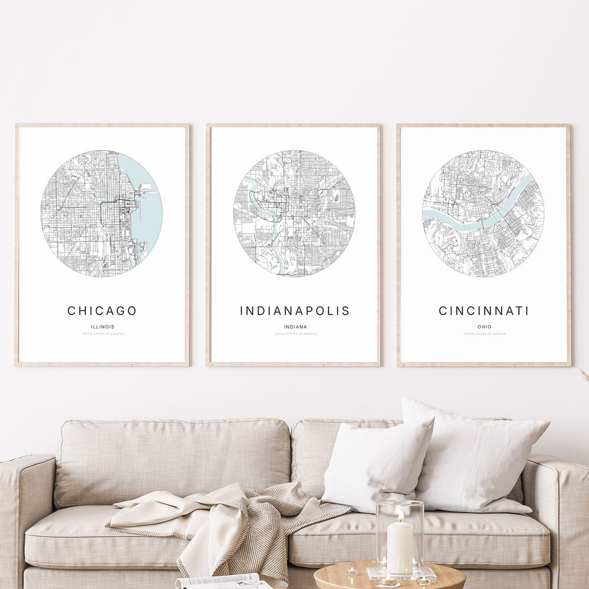 Trio of Chicago, Indianapolis and Cincinnati city map posters in a living room.