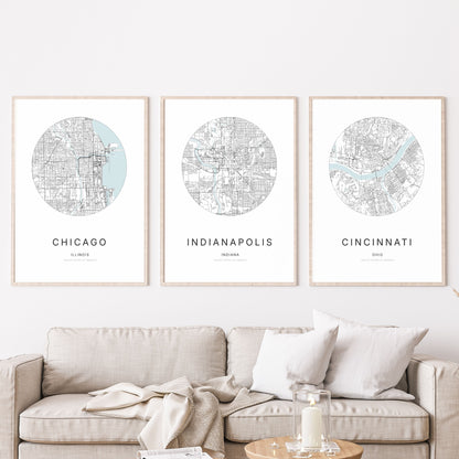 Trio of Chicago, Indianapolis and Cincinnati city map posters in a living room.