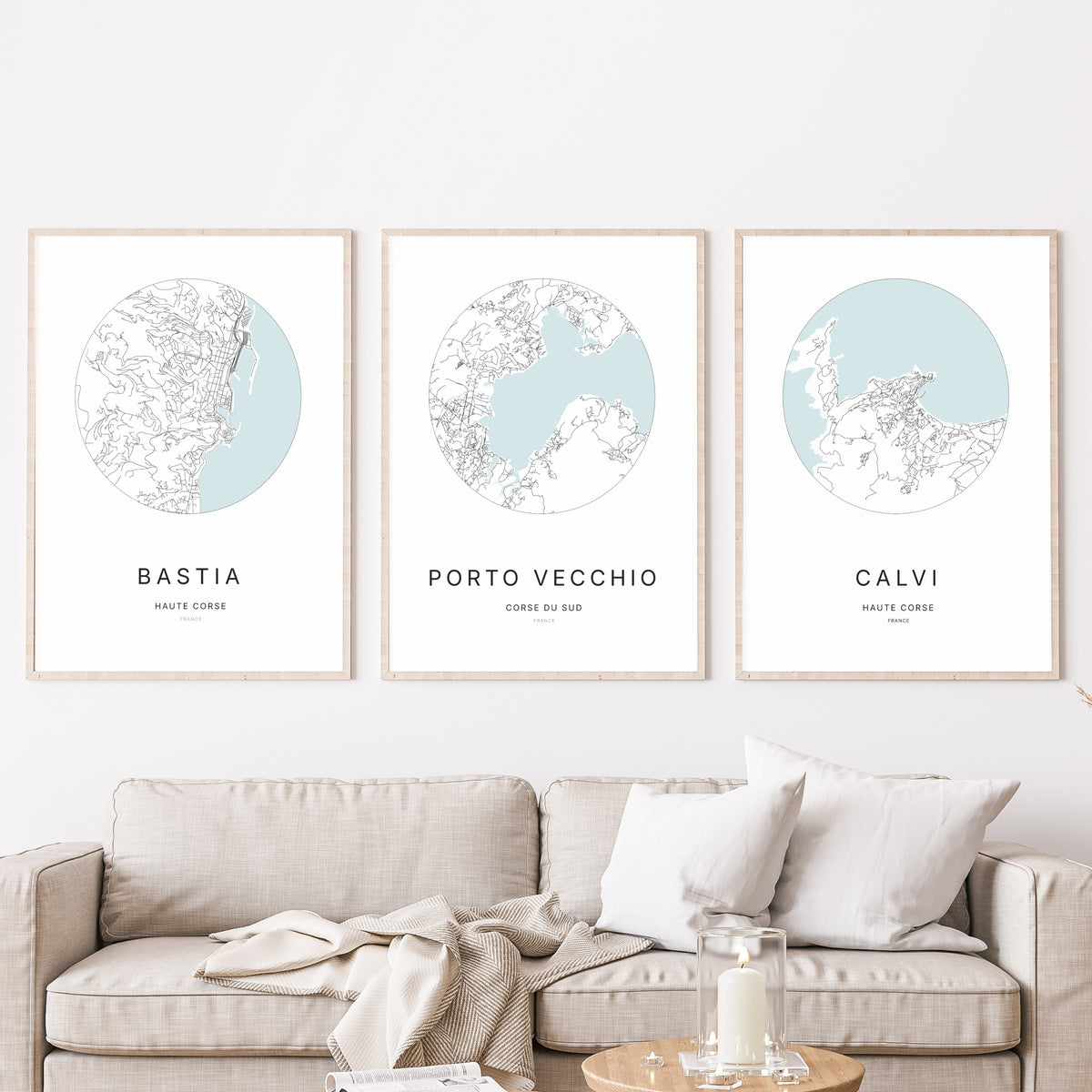Trio of Porto-Vecchio, Bastia and Calvi city map prints in a living room.