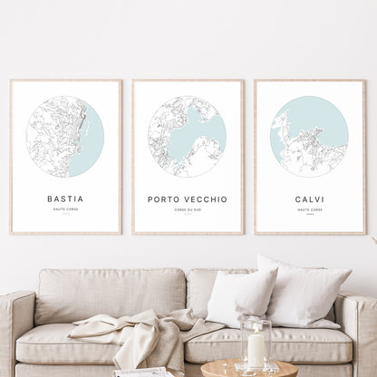 Trio of Porto-Vecchio, Bastia and Calvi city map prints in a living room.
