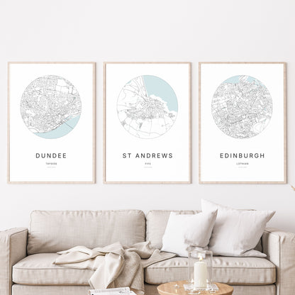 Trio of Dundee, St Andrews and Edinburgh city map prints in a living room.