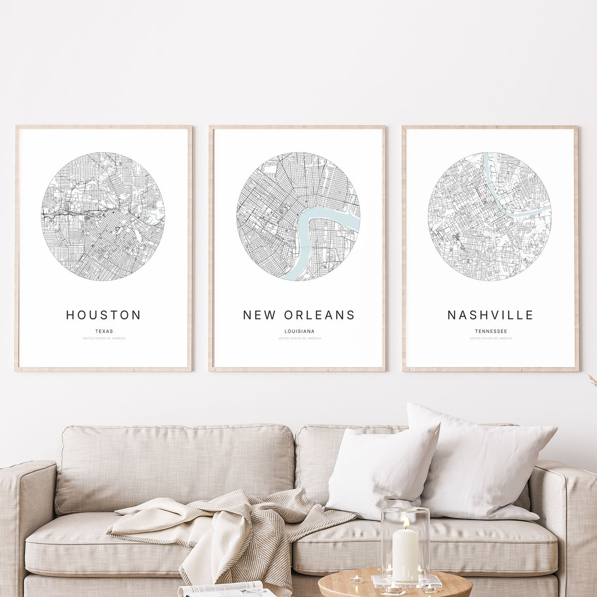 Trio of Houston, New Orleans and Nashville city map posters in a living room.