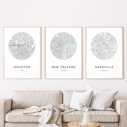 Trio of Houston, New Orleans and Nashville city map posters in a living room.