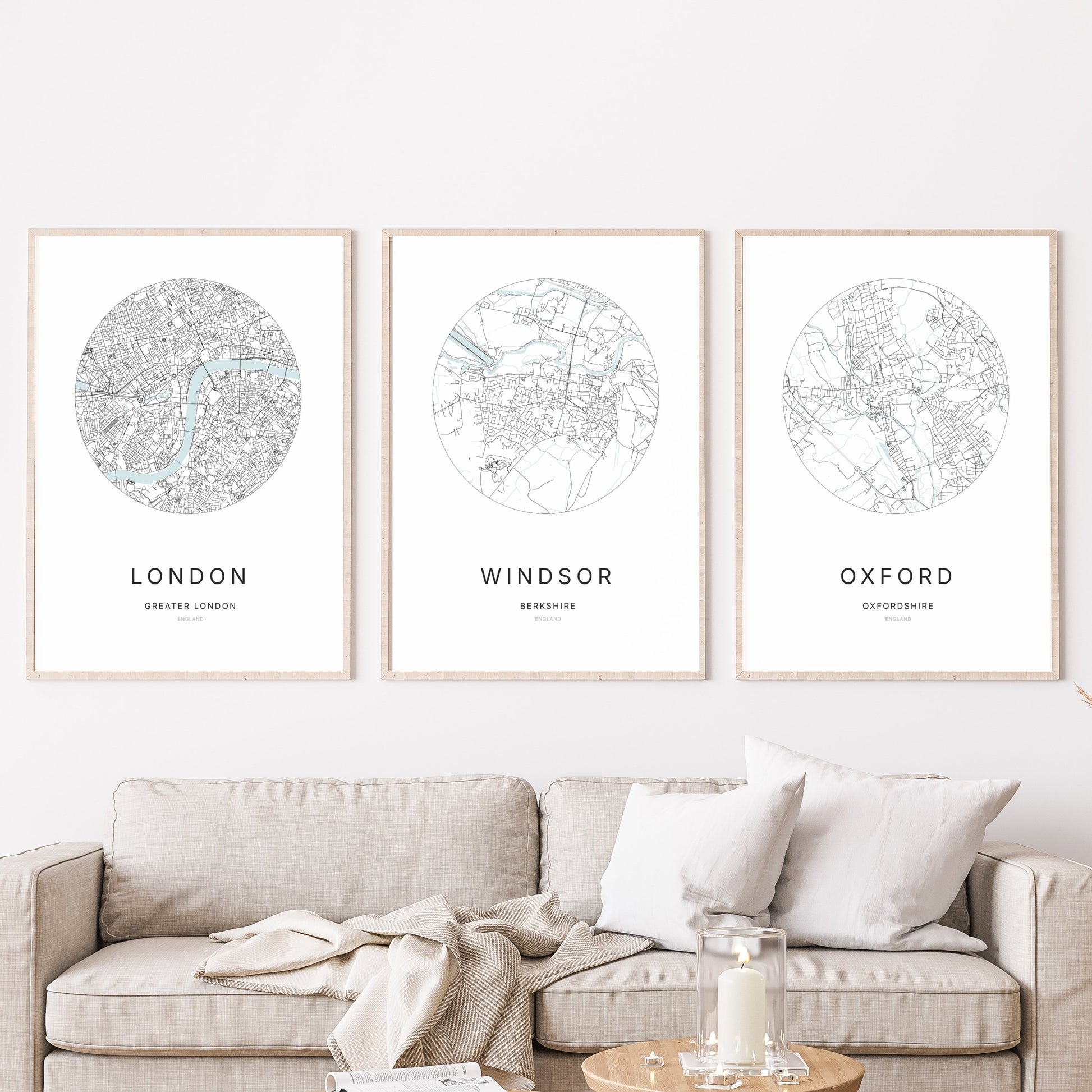 Trio of London, Windsor and Oxford city map prints in a living room.