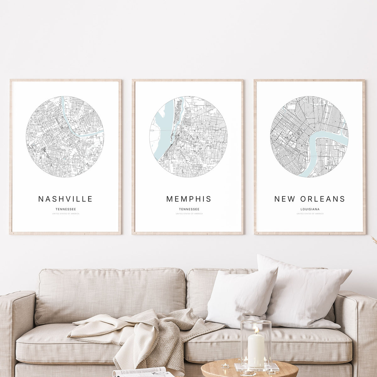 Trio of Nashville, Memphis and New Orleans city map posters in a living room.