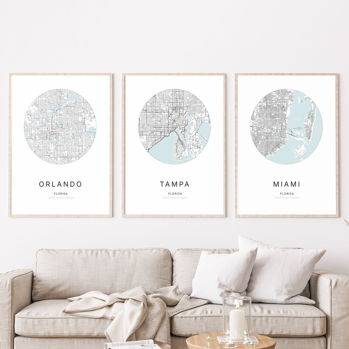 Trio of Orlando, Tampa and Miami city map posters in a living room.