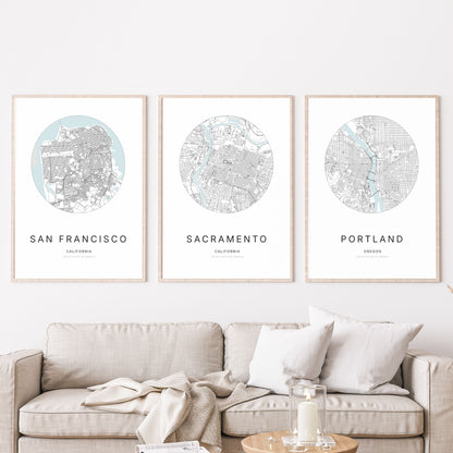 Trio of San Francisco, Sacramento and Portland city map posters in a living room.