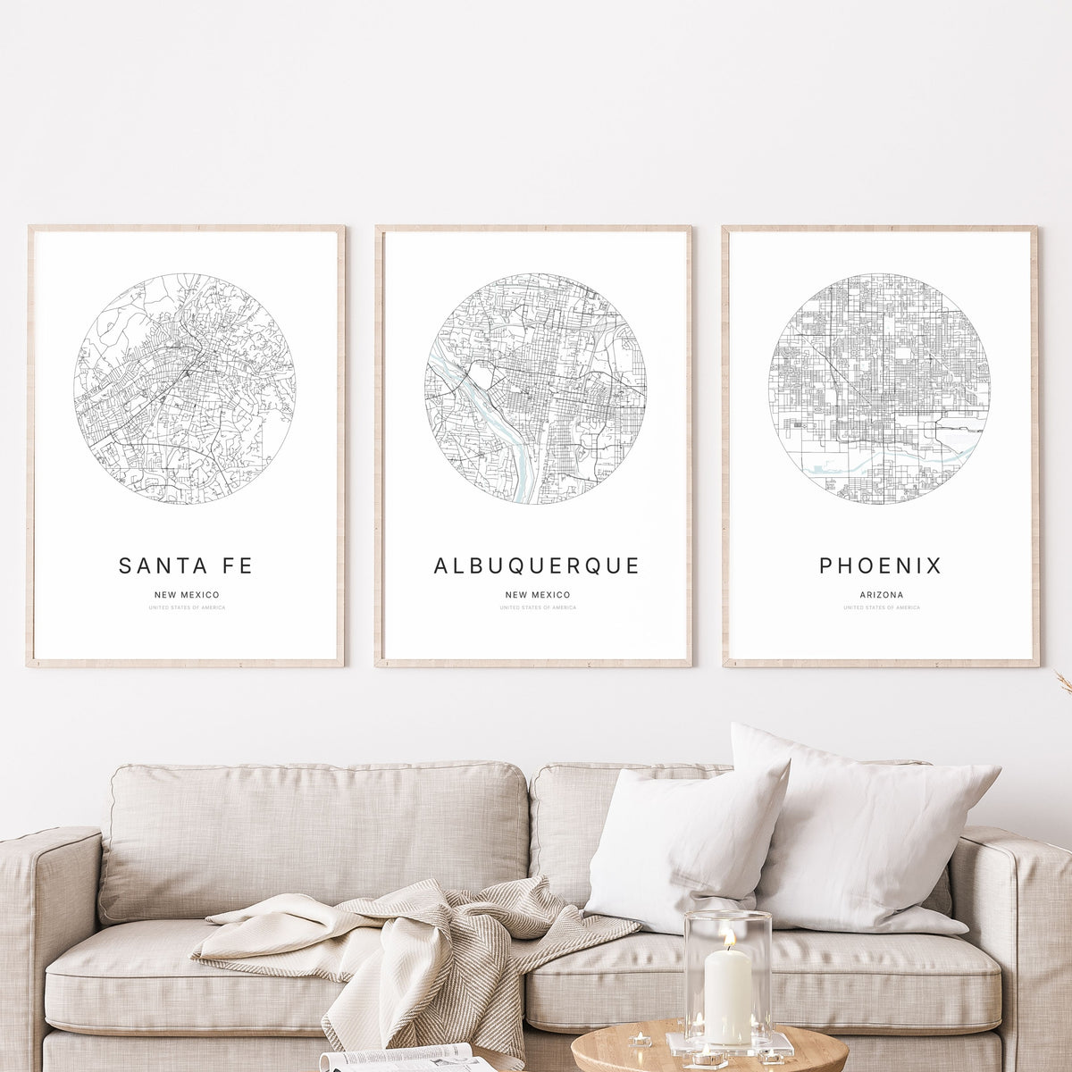Trio of Santa Fe, Albuquerque and Phoenix city map posters in a living room.