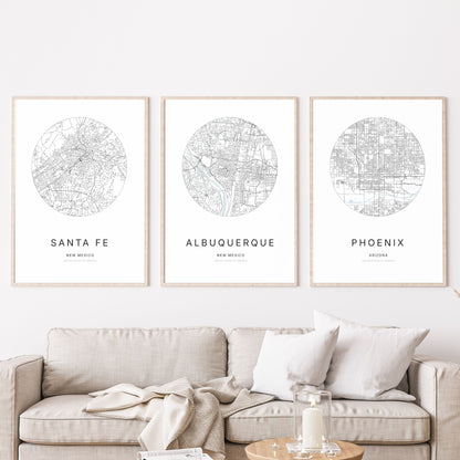 Trio of Santa Fe, Albuquerque and Phoenix city map posters in a living room.