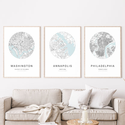 Trio d’affiches de Washington, Annapolis et Philadelphie dans un salon.