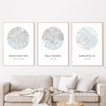 Trio of Washington, DC, Baltimore and Annapolis city map posters in a living room.