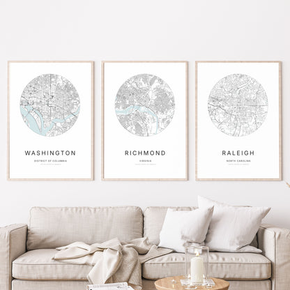 Trio of Washington, DC, Richmond and Raleigh city map posters in a living room.
